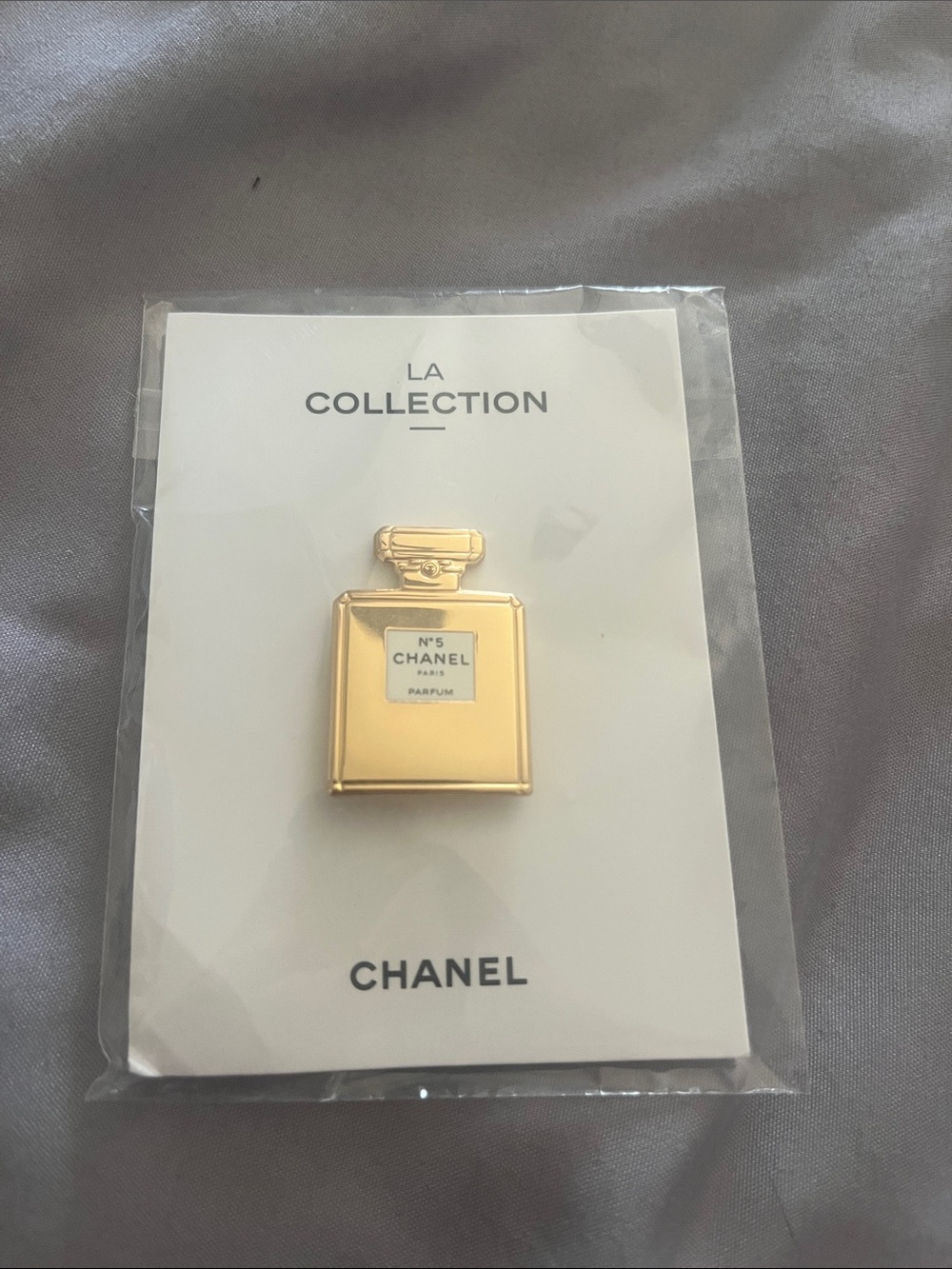 CHANEL Gold Tone Perfume Bottle Pin Brooch with White Enamel Label